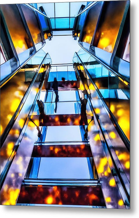 A woman climbing up a staircase near a tower of glass stairs