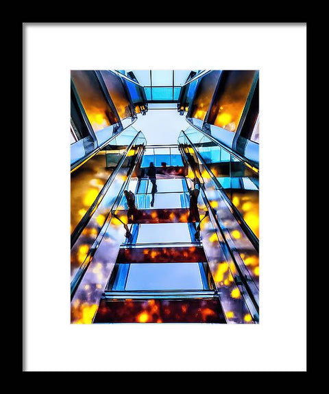 A stairway going up to the top of the building with an art print on the