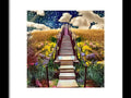 A row of steps going up a wooden staircase by an art print
