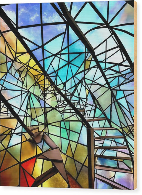 A woman standing on top of a pile of stained glass at the bottom of the staircase